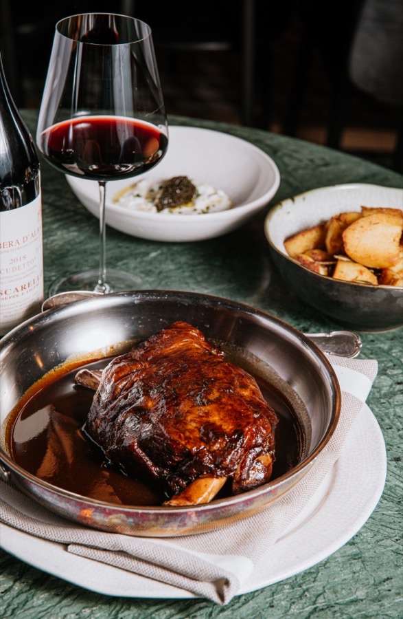Lamb shoulder, slow-roasted in Barolo wine with aromatic herbs