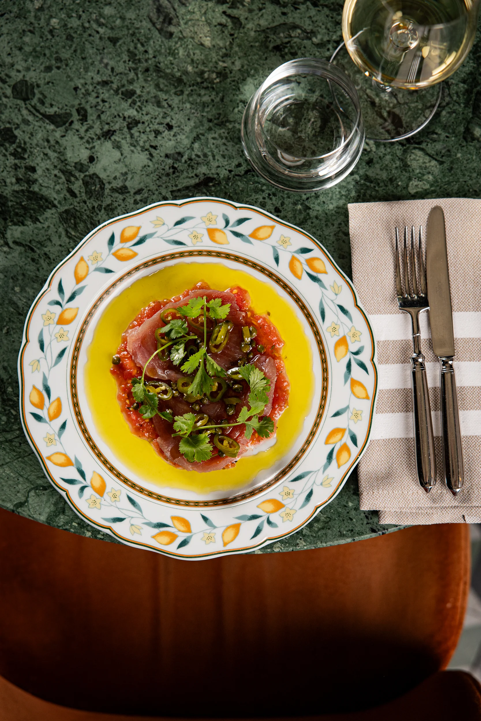 Tuna Carpaccio with tomatoes, cilantro, pickled chilis and Capperini